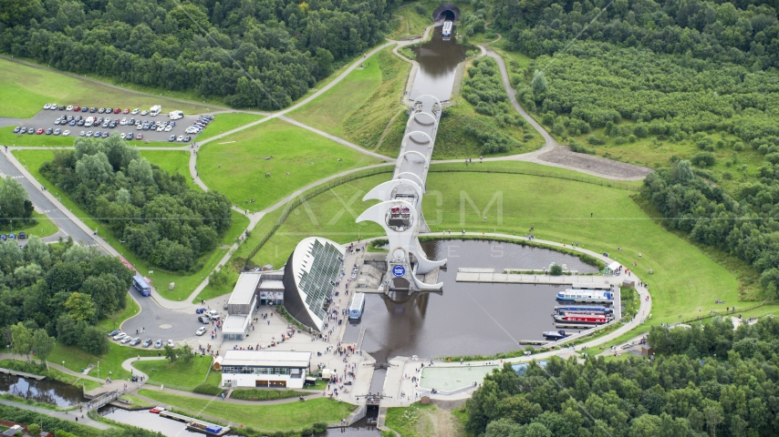 A view of the Falkirk Wheel near trees, Scotland Aerial Stock Photo AX109_141.0000000F | Axiom Images