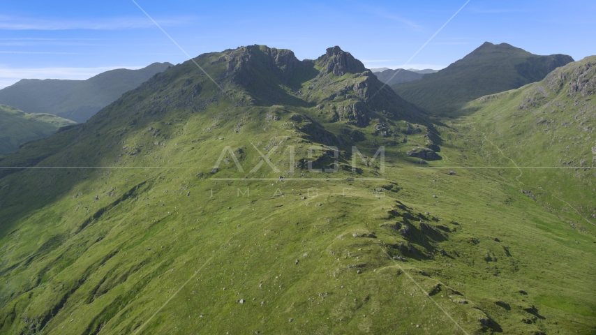 The Cobbler mountain peak in Scottish Highlands, Scotland, United Kingdom Aerial Stock Photo AX110_071.0000000F | Axiom Images
