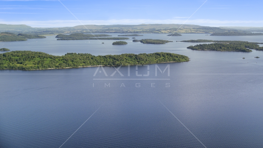 Tree-covered islands in Loch Lomond, Scottish Highlands, Scotland Aerial Stock Photo AX110_106.0000000F | Axiom Images