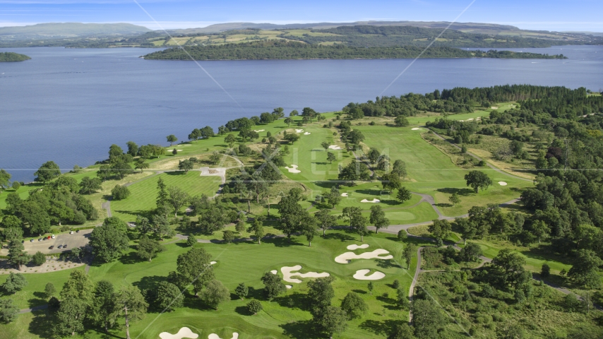 Loch Lomond Golf Course beside the water, Luss, Scottish Highlands, Scotland Aerial Stock Photo AX110_116.0000000F | Axiom Images
