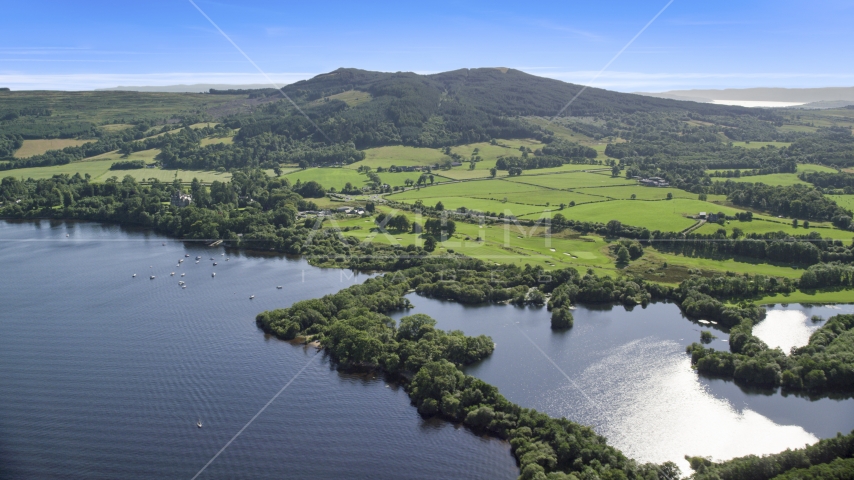 Farms beside Loch Lomond in Arden, Scottish Highlands, Scotland Aerial Stock Photo AX110_125.0000000F | Axiom Images