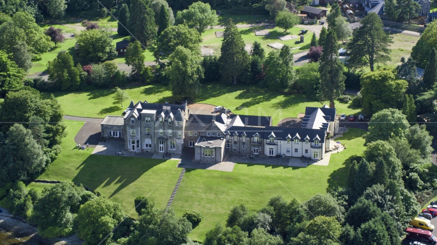 Lomond Castle in Arden, Scottish Highlands, Scotland Aerial Stock Photo AX110_126.0000203F | Axiom Images