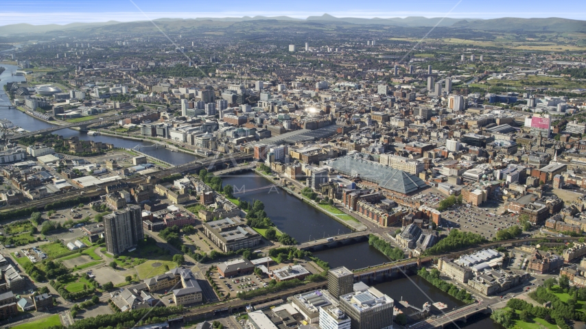 River Clyde with bridges by city buildings in Glasgow, Scotland Aerial Stock Photo AX110_167.0000000F | Axiom Images