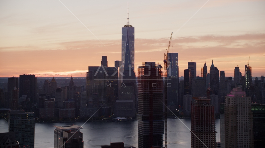 World Trade Center skyline at sunrise in Lower Manhattan, New York City, seen from Jersey City Aerial Stock Photo AX118_032.0000166F | Axiom Images