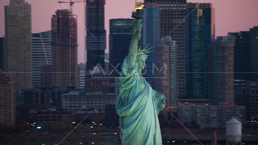 The Statue of Liberty at sunrise, New York Aerial Stock Photo AX118_046.0000299F | Axiom Images