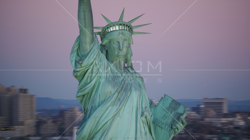 The Statue of Liberty at sunrise, New York Aerial Stock Photo AX118_059.0000012F | Axiom Images