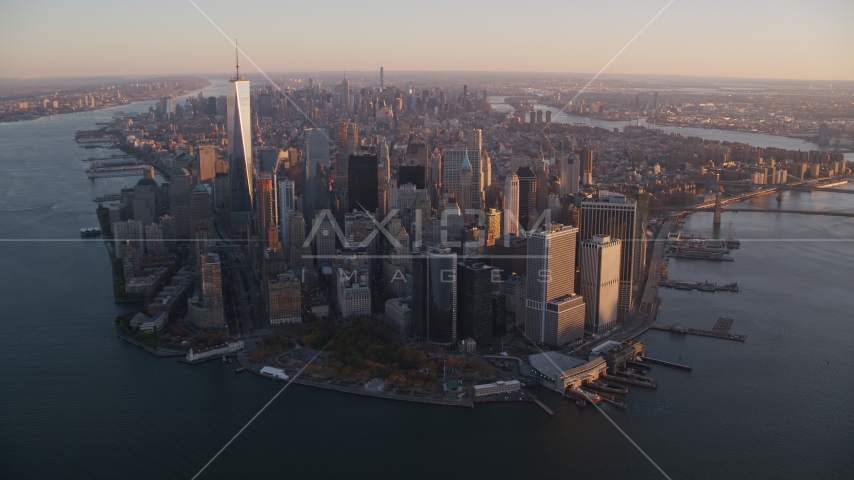 Battery Park and Lower Manhattan skyscrapers at sunrise, New York City Aerial Stock Photo AX118_086.0000165F | Axiom Images