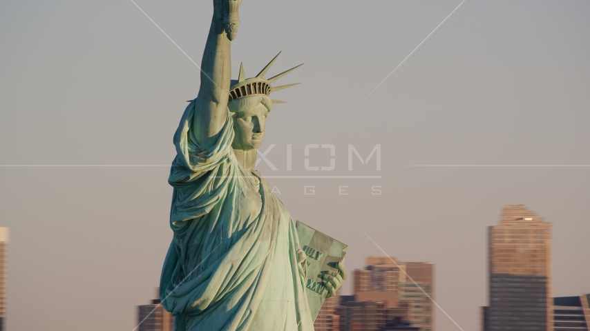 Profile of the Statue of Liberty at sunrise in New York Aerial Stock Photo AX118_108.0000070F | Axiom Images