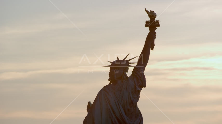 Back of the Statue of Liberty at sunrise in New York Aerial Stock Photo AX118_111.0000000F | Axiom Images