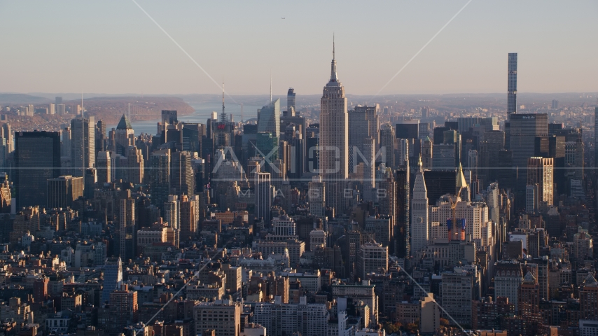 Empire State Building and Midtown Manhattan buildings at sunrise in New York City Aerial Stock Photo AX118_169.0000092F | Axiom Images