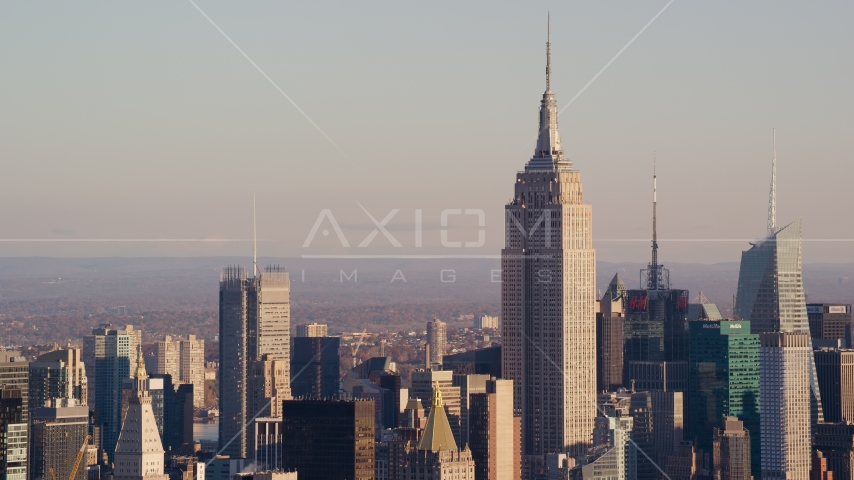 The Empire State Building in Midtown Manhattan at sunrise in New York City Aerial Stock Photo AX118_174.0000088F | Axiom Images
