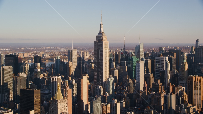 The Empire State Building and surrounding Midtown high-rises at sunrise in New York City Aerial Stock Photo AX118_178.0000099F | Axiom Images