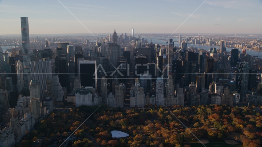 Midtown skyscrapers and Central Park in Autumn at sunrise in New York City Aerial Stock Photo AX118_196.0000150F | Axiom Images
