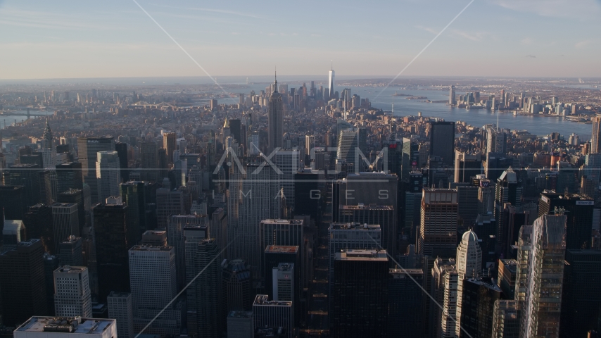 Midtown and Downtown Manhattan skyscrapers at sunrise in New York City Aerial Stock Photo AX118_198.0000141F | Axiom Images