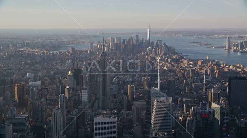 Empire State Building and Downtown skyscrapers at sunrise in New York City Aerial Stock Photo AX118_200.0000105F | Axiom Images