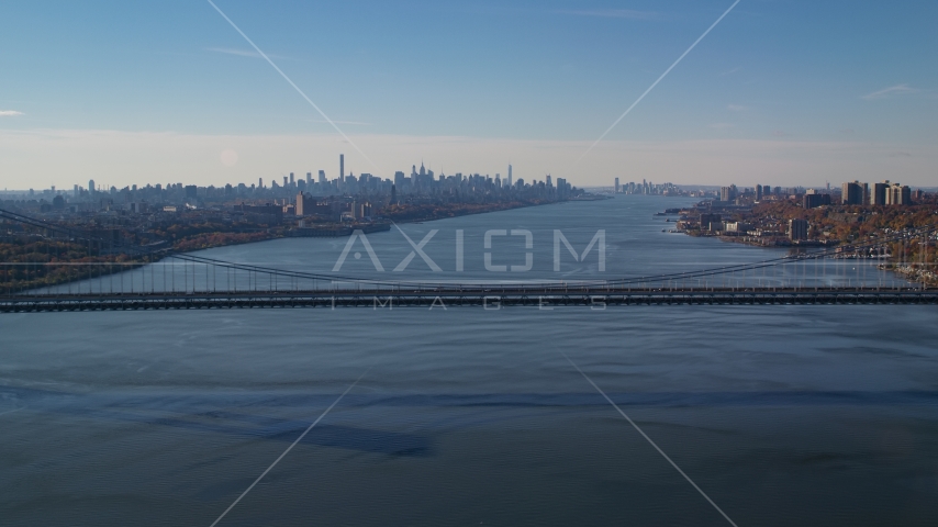 George Washington Bridge, Hudson River, and the Midtown skyline in Autumn, New York City Aerial Stock Photo AX119_047.0000192F | Axiom Images