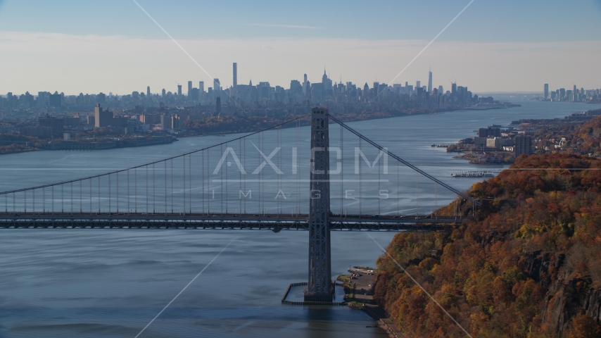 Midtown skyline behind the George Washington Bridge and the Hudson River in Autumn, New York City Aerial Stock Photo AX119_050.0000022F | Axiom Images