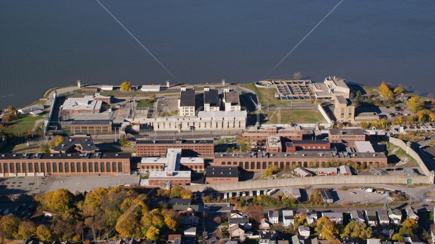 Sing Sing Prison beside the Hudson River in Autumn, Ossining, New York Aerial Stock Photo AX119_115.0000090F | Axiom Images