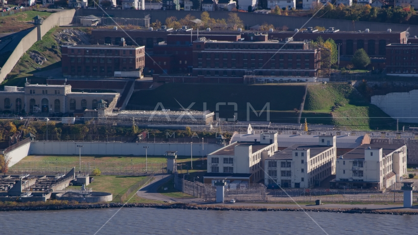 Riverfront buildings at Sing Sing Prison in Autumn, Ossining, New York Aerial Stock Photo AX119_123.0000182F | Axiom Images
