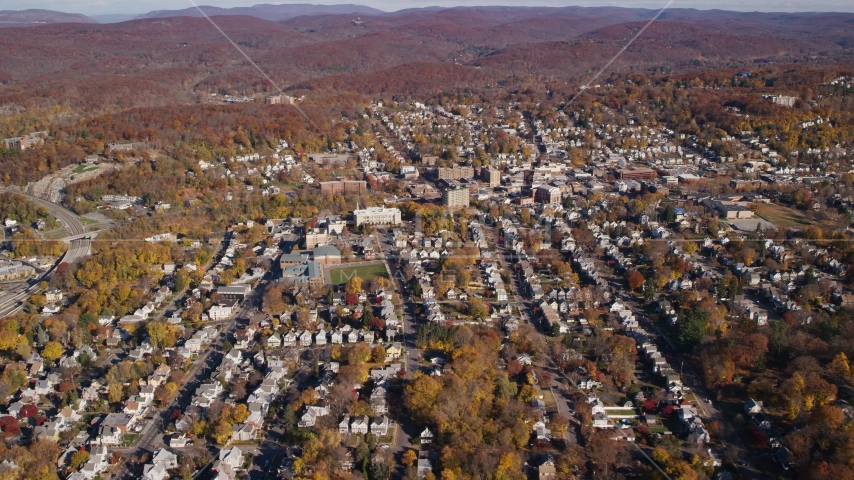 Small town residential neighborhoods in Autumn, Peekskill, New York Aerial Stock Photo AX119_145.0000103F | Axiom Images