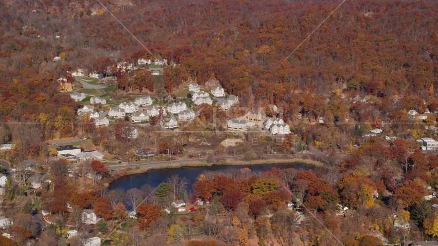 Condominium complexes overlooking Garrison Pond in Autumn, Fort Montgomery, New York Aerial Stock Photo AX119_157.0000152F | Axiom Images