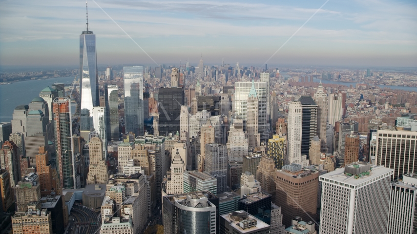 A view over the tops of Lower Manhattan skyscrapers, New York City Aerial Stock Photo AX120_125.0000061F | Axiom Images