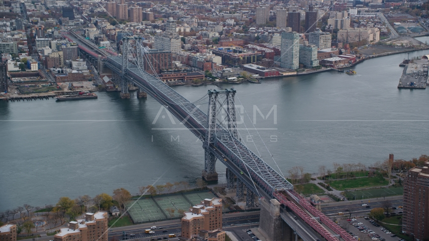 The Williamsburg Bridge spanning the East River in Autumn, New York City Aerial Stock Photo AX120_153.0000347F | Axiom Images