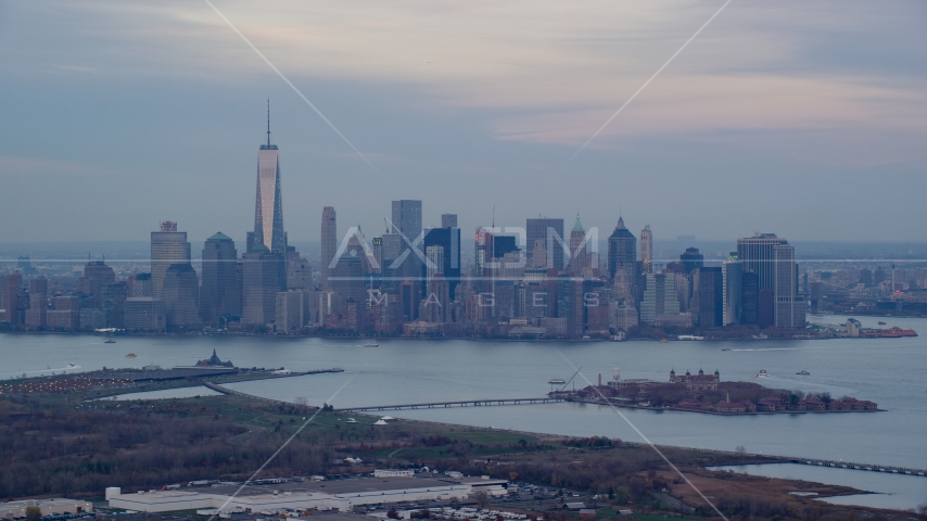 Lower Manhattan skyline and Ellis Island at sunset in Autumn, New York City Aerial Stock Photo AX121_011.0000090F | Axiom Images