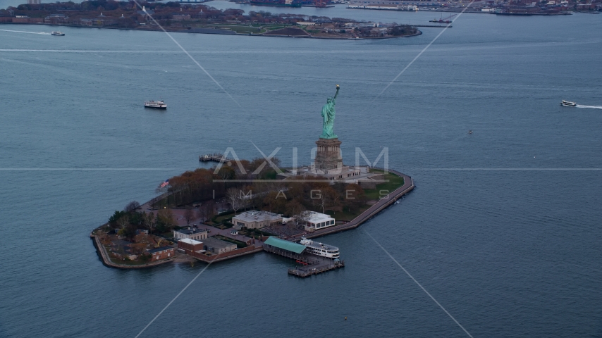 The Statue of Liberty at sunset In Autumn, New York Aerial Stock Photo AX121_013.0000082F | Axiom Images
