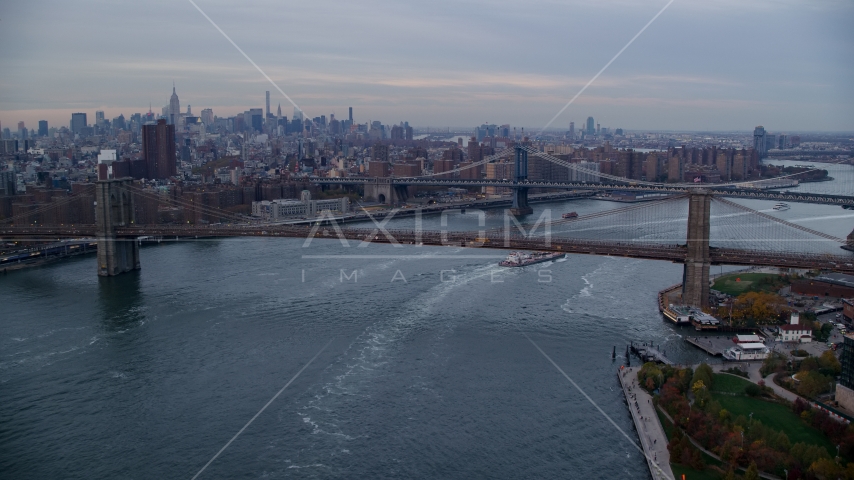 The Brooklyn and Manhattan Bridges at sunset in New York City Aerial Stock Photo AX121_023.0000020F | Axiom Images