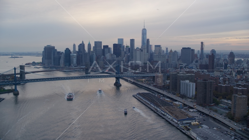 The Manhattan Bridge and the Lower Manhattan skyline at sunset in New York City Aerial Stock Photo AX121_027.0000009F | Axiom Images