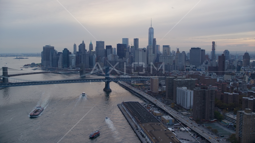 Manhattan Bridge and the Lower Manhattan skyline at sunset in New York City Aerial Stock Photo AX121_027.0000270F | Axiom Images
