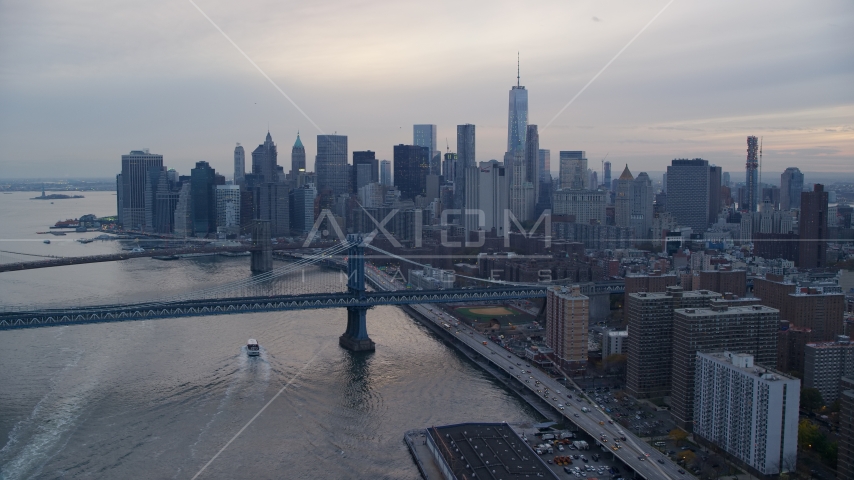 The Manhattan Bridge near the Lower Manhattan skyline at sunset in New York City Aerial Stock Photo AX121_028.0000216F | Axiom Images