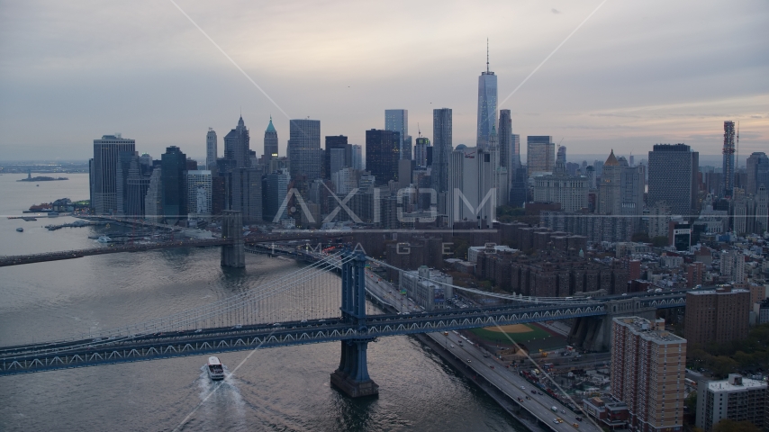 The Brooklyn Bridge, Manhattan Bridge, and Lower Manhattan at sunset in New York City Aerial Stock Photo AX121_029.0000120F | Axiom Images