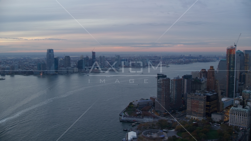 Downtown Jersey City, New Jersey at sunset seen across the Hudson River Aerial Stock Photo AX121_035.0000185F | Axiom Images