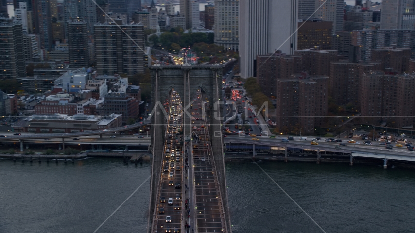 Heavy traffic on the Brooklyn Bridge at sunset in New York City Aerial Stock Photo AX121_040.0000074F | Axiom Images