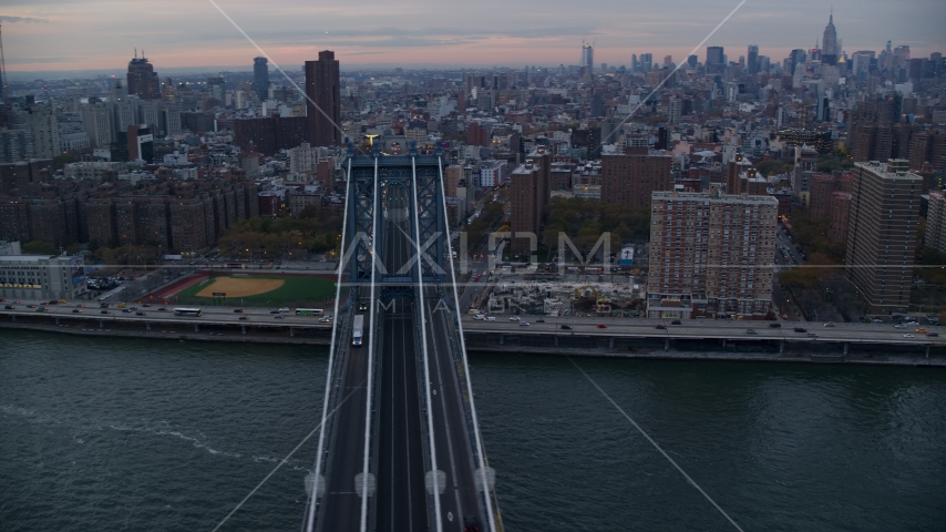 Light traffic on the Manhattan Bridge at sunset in New York City Aerial Stock Photo AX121_041.0000083F | Axiom Images