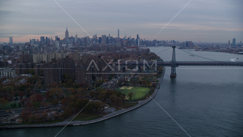 Lower East Side projects, the Williamsburg Bridge, and Midtown skyline at sunset in New York City Aerial Stock Photo AX121_044.0000009F | Axiom Images