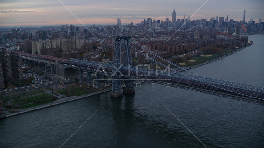 The Williamsburg Bridge at sunset in New York City Aerial Stock Photo AX121_045.0000046F | Axiom Images