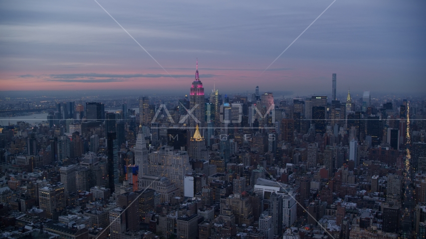 Midtown high-rises and the Empire State Building at sunset in New York City Aerial Stock Photo AX121_079.0000199F | Axiom Images