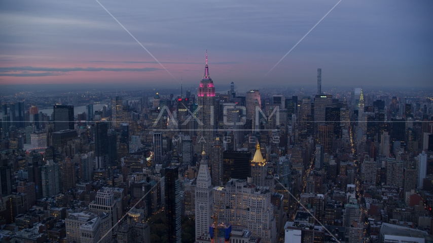 The Empire State Building and Midtown Manhattan skyscrapers at sunset in New York City Aerial Stock Photo AX121_081.0000000F | Axiom Images