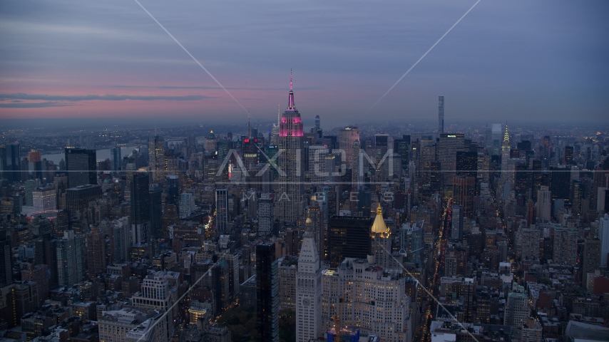 The Empire State Building and Midtown high-rises at sunset in New York City Aerial Stock Photo AX121_081.0000054F | Axiom Images