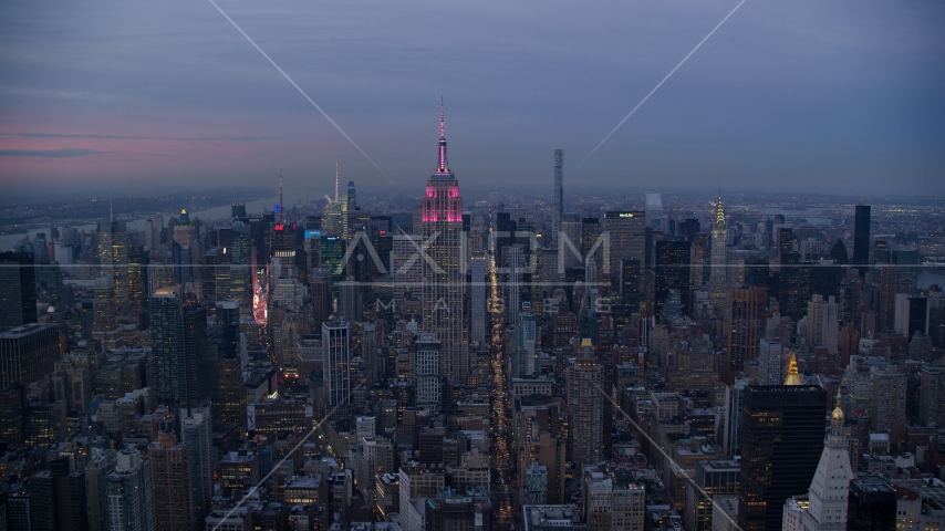 A view of the Empire State Building in Midtown at sunset in New York City Aerial Stock Photo AX121_082.0000155F | Axiom Images