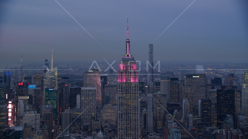Top of Empire State Building at sunset in Midtown Manhattan, New York City Aerial Stock Photo AX121_083.0000005F | Axiom Images