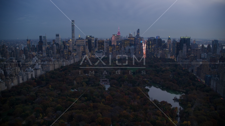 Midtown skyscrapers and The Lake in Central Park at sunset, New York City Aerial Stock Photo AX121_098.0000102F | Axiom Images