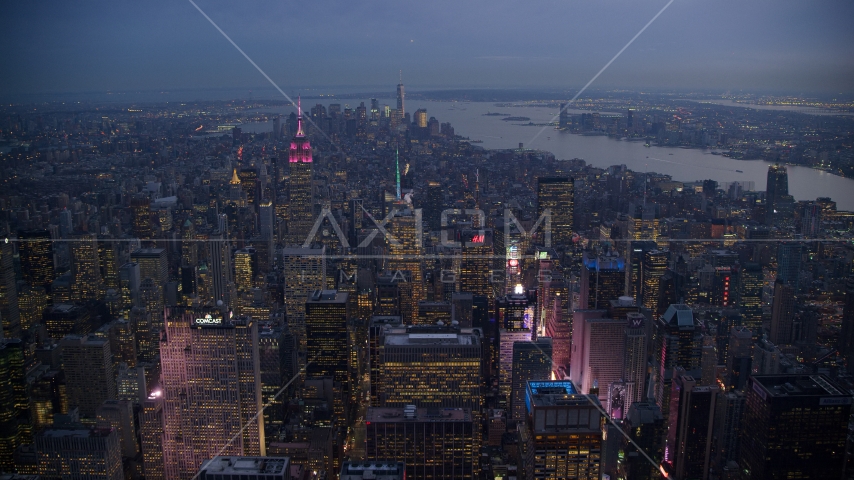Times Square and Midtown skyscrapers with Lower Manhattan in the background at sunset, New York City Aerial Stock Photo AX121_103.0000219F | Axiom Images