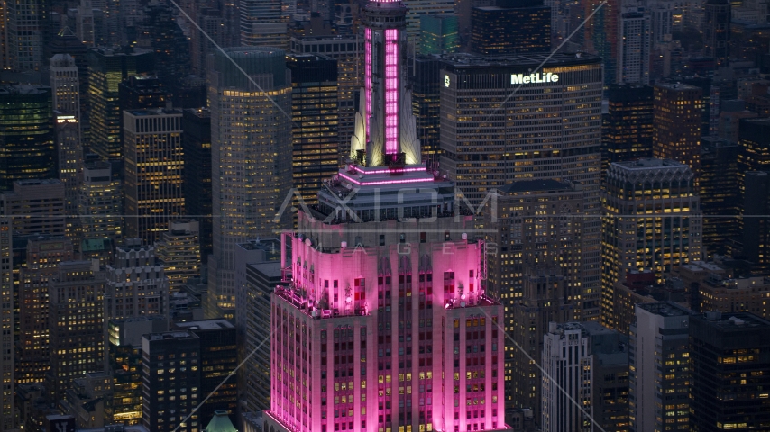 Pink lights on the Empire State Building at sunset in Midtown Manhattan, New York City Aerial Stock Photo AX121_109.0000359F | Axiom Images