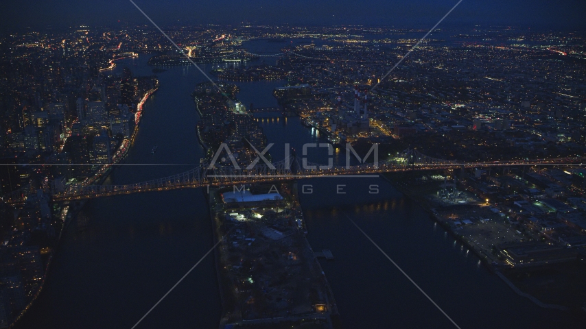 The Queensboro Bridge and Roosevelt Island at night in New York City Aerial Stock Photo AX121_141.0000095F | Axiom Images