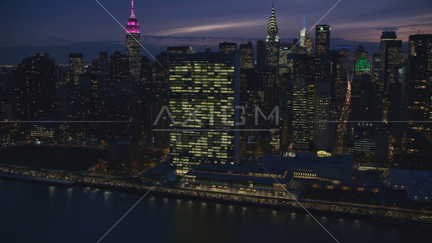 The United Nations building at night in New York City Aerial Stock Photo AX121_146.0000110F | Axiom Images