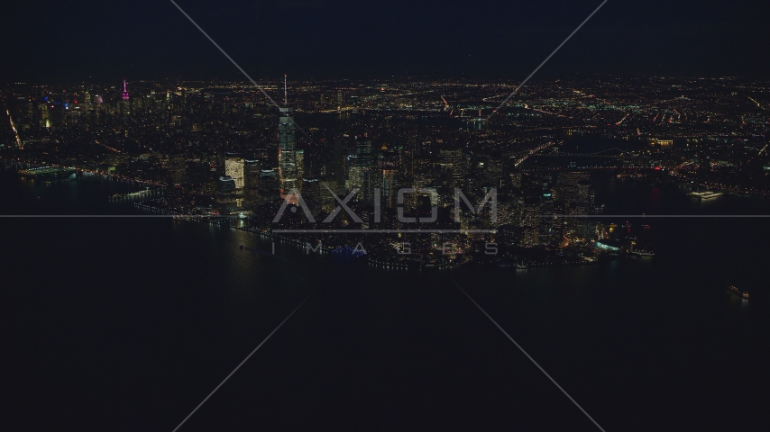 Lower Manhattan at night, New York City, seen from New York Harbor Aerial Stock Photo AX121_171.0000102F | Axiom Images